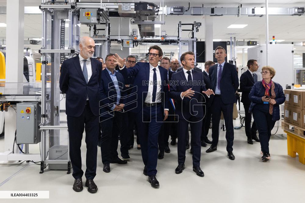 President Macron Visits EssilorLuxottica Laboratory - Wissous