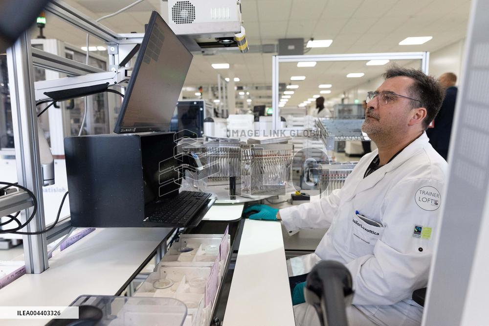 President Macron Visits EssilorLuxottica Laboratory - Wissous