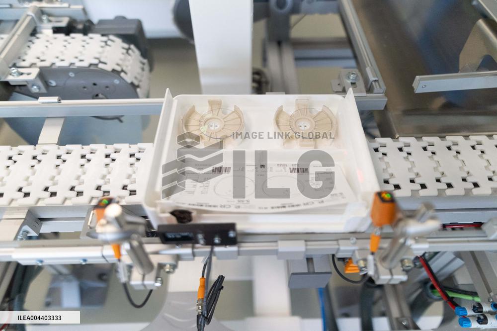 President Macron Visits EssilorLuxottica Laboratory - Wissous