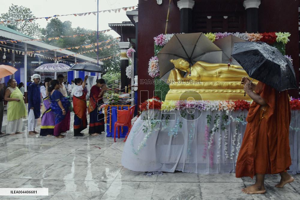 Devotees Pray at Buddha Temple - India