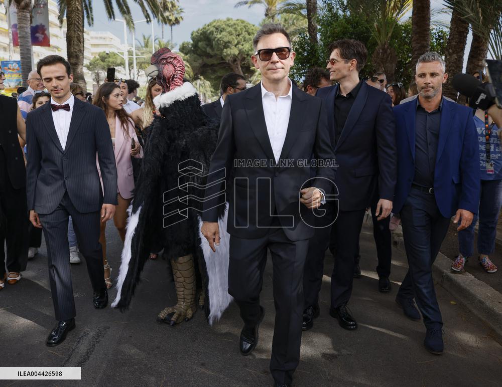 Cannes Raphael Quenard, Francois Civil, Michel Hazanavicius walk with condor from Hotel Martinez MP
