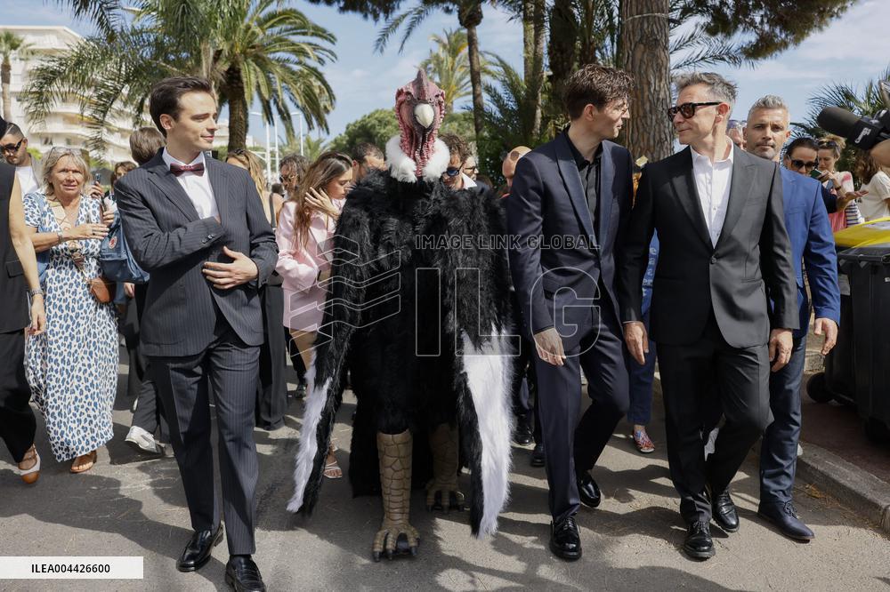 Cannes Raphael Quenard, Francois Civil, Michel Hazanavicius walk with condor from Hotel Martinez MP