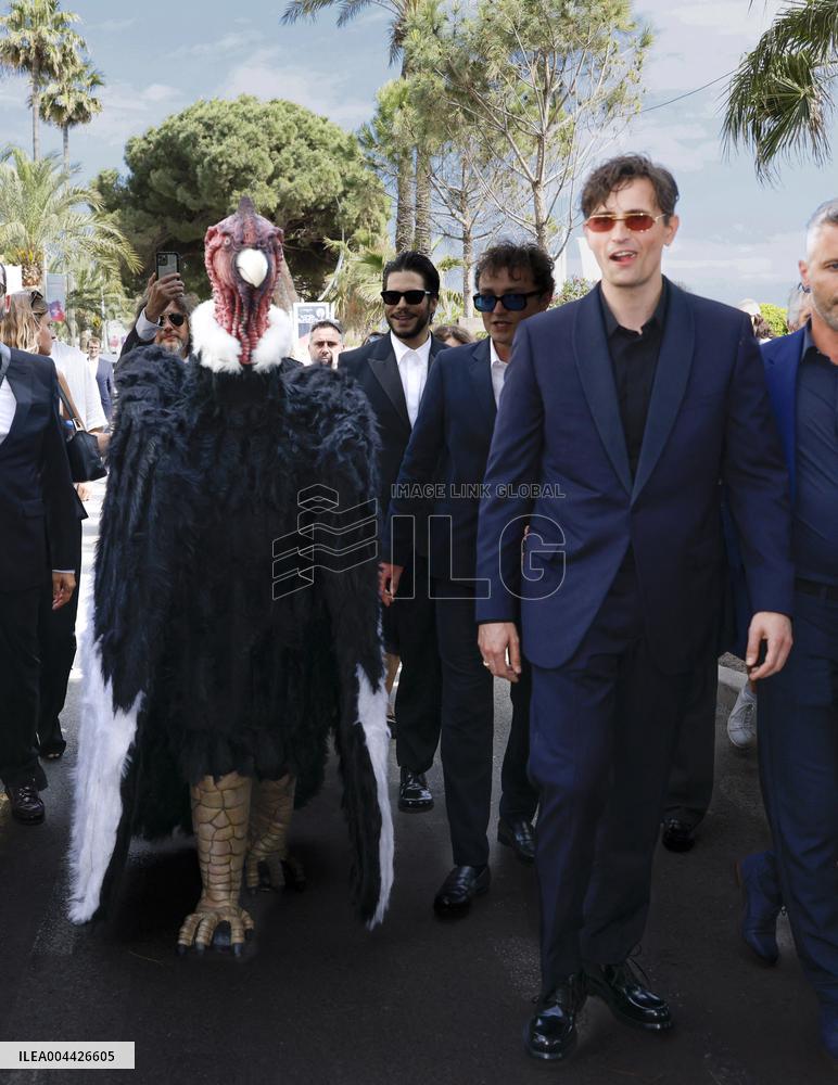 Cannes Raphael Quenard, Francois Civil, Michel Hazanavicius walk with condor from Hotel Martinez MP