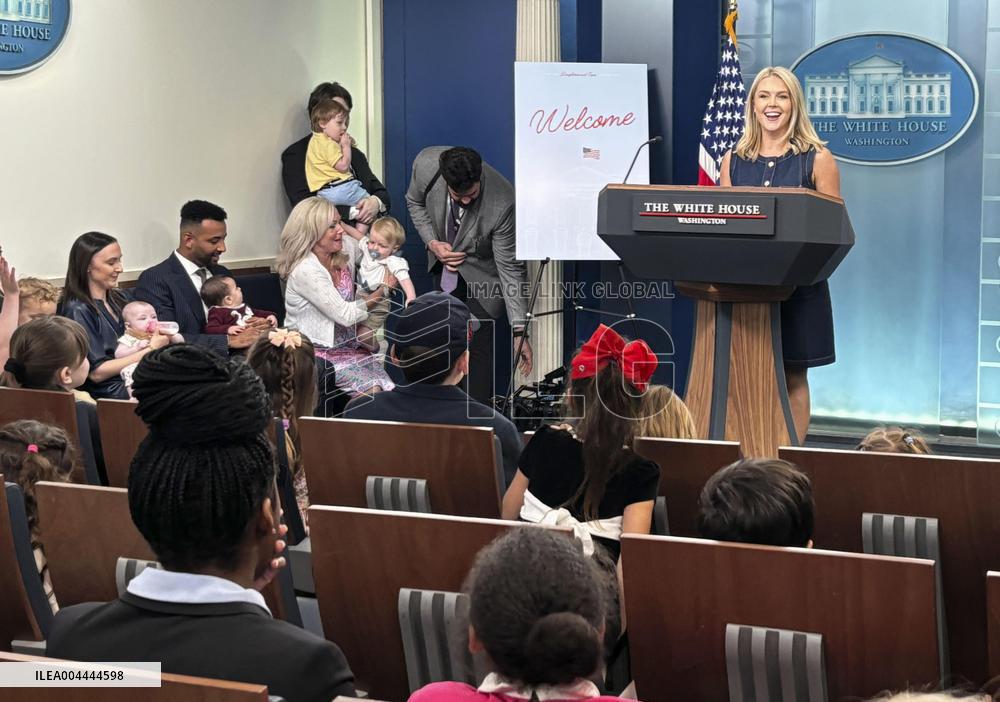 White House press secretary meets children in briefing room