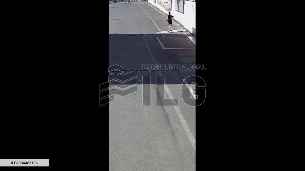 China: Woman Knocked Over by Flying Metal Sheet in Strong Winds