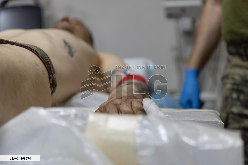 Ukrainian Medics Assist Wounded Soldier in Kharkiv