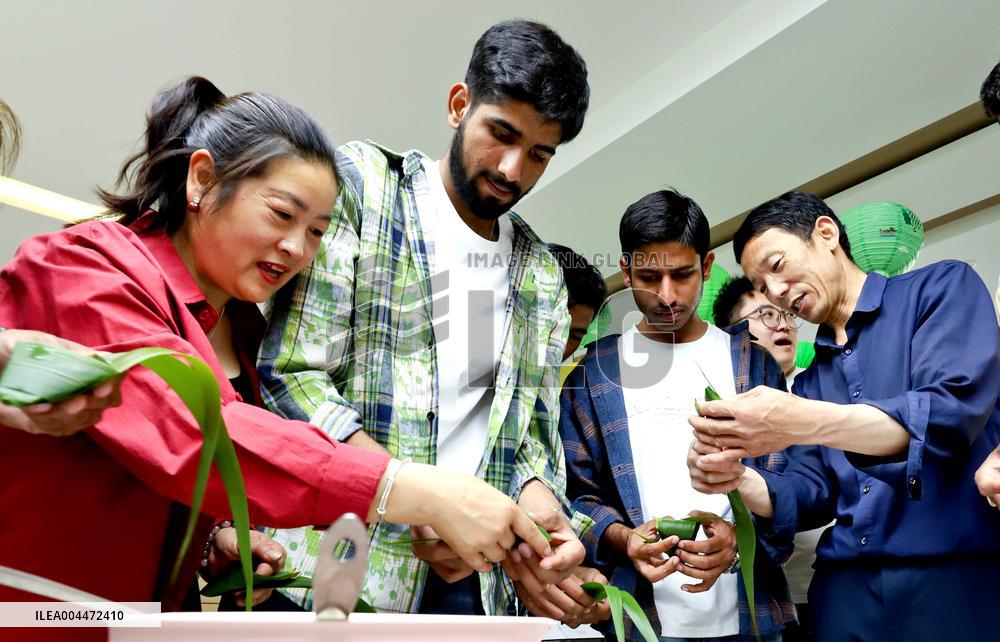 Foreigners Experience China Dragon Boat Festival