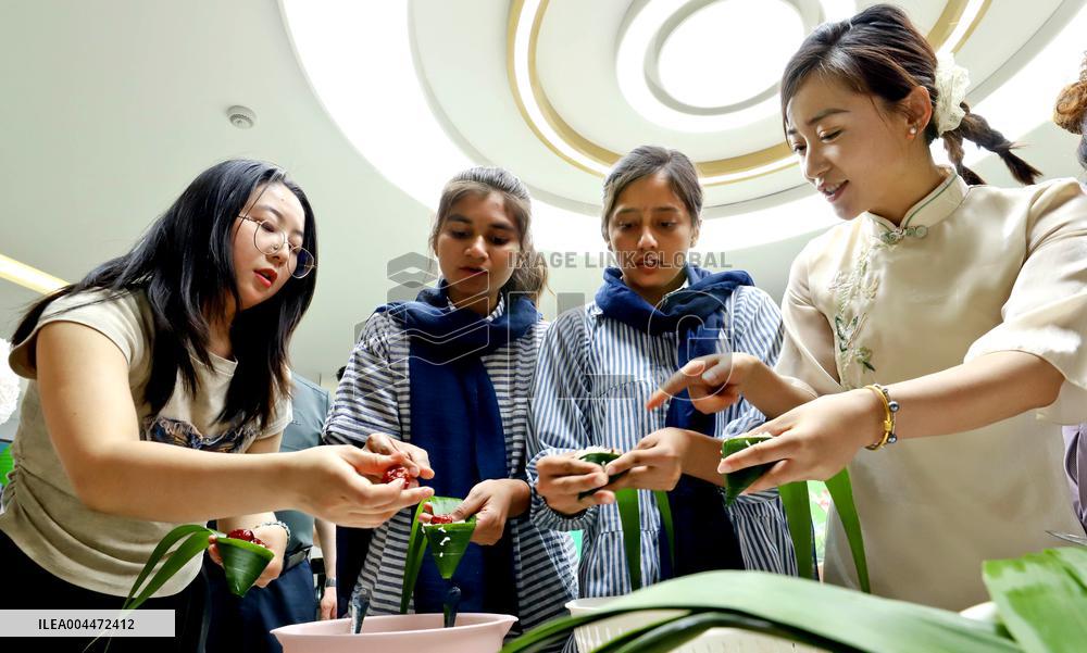 Foreigners Experience China Dragon Boat Festival