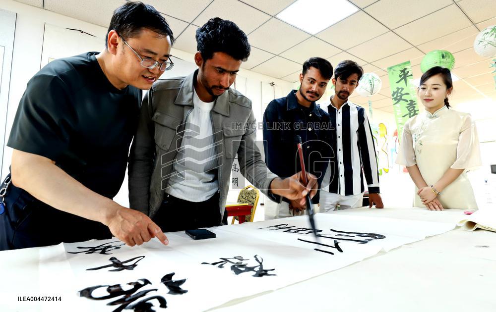 Foreigners Experience China Dragon Boat Festival