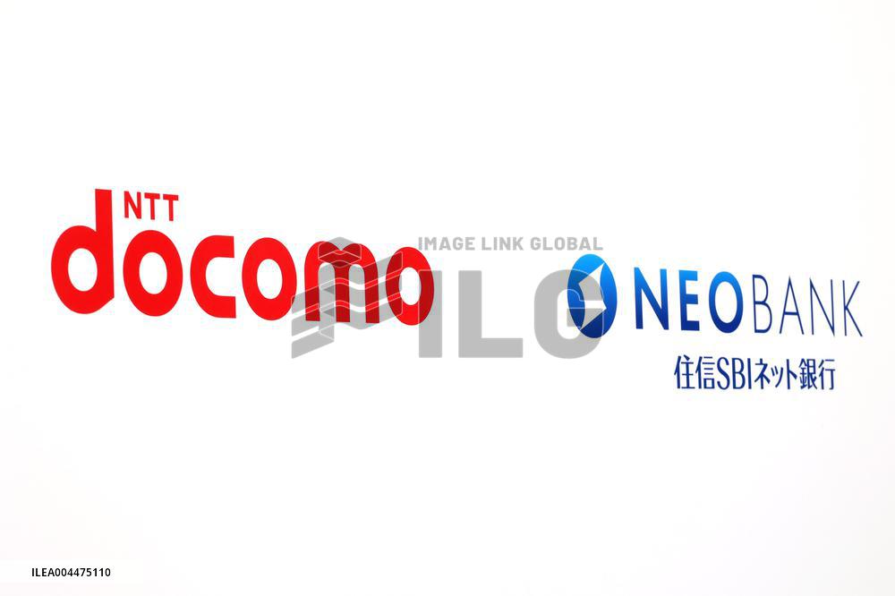 Signs and logos of NTT DoCoMo and SBI Sumishin Net Bank.