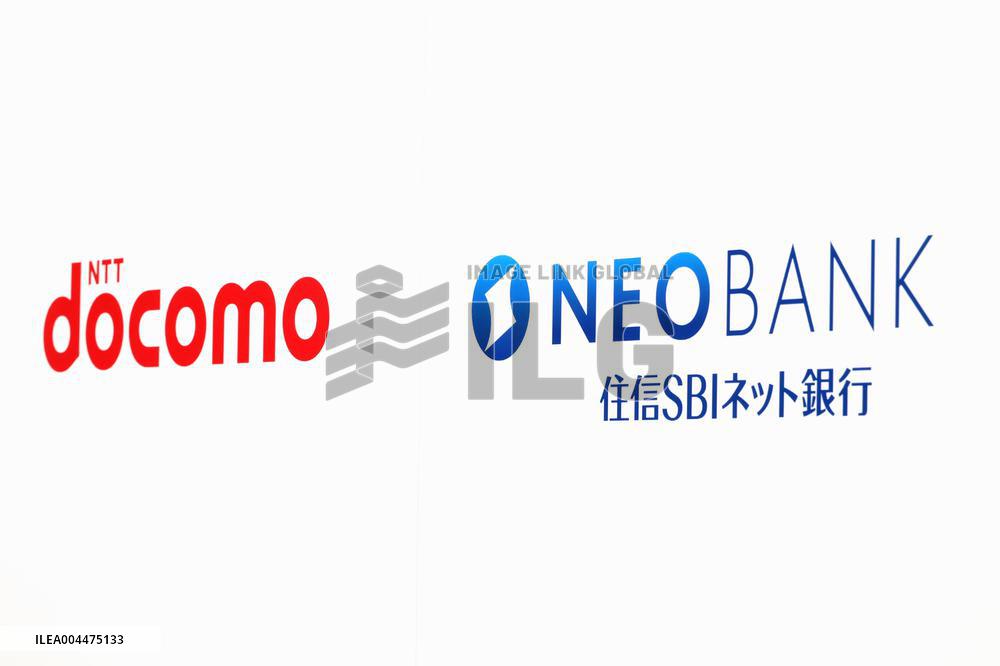 Signs and logos of NTT DoCoMo and SBI Sumishin Net Bank.