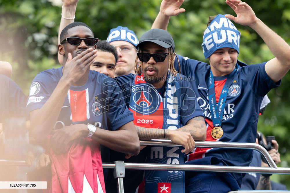 Supporters cheer the PSG in a parade in Paris - AJ