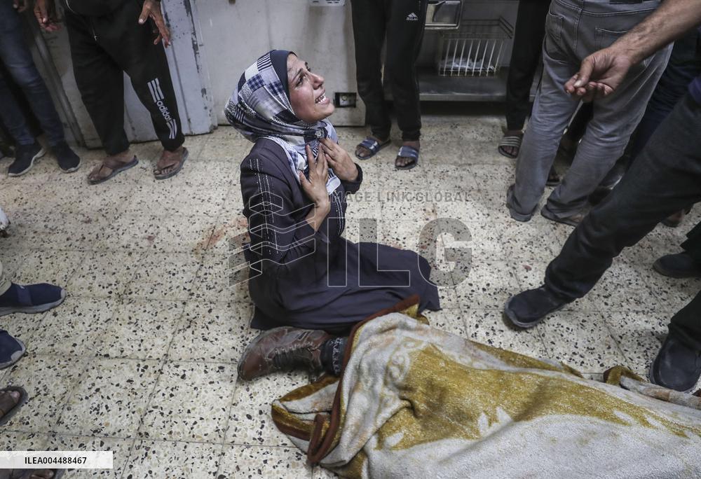 Palestinian Man Mourns Airstrike Victim - Gaza