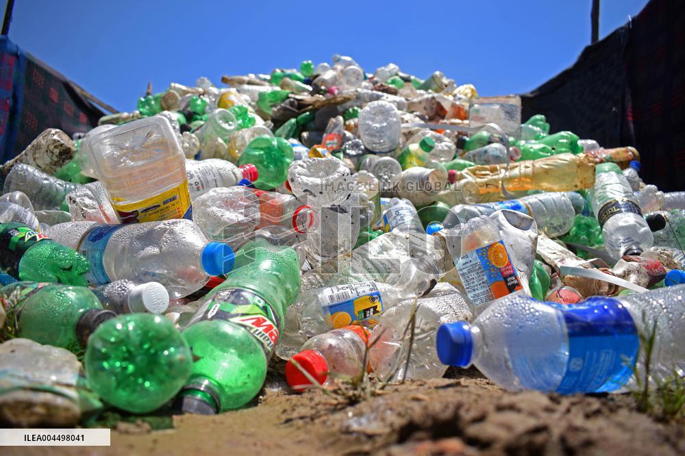 People Recycle Plastic Bottles - India