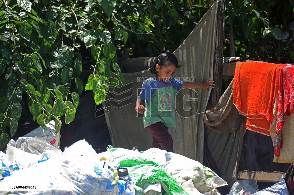 People Recycle Plastic Bottles - India