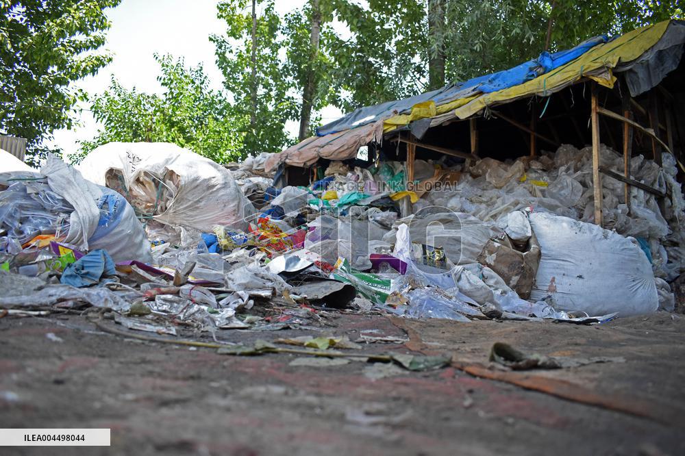 People Recycle Plastic Bottles - India