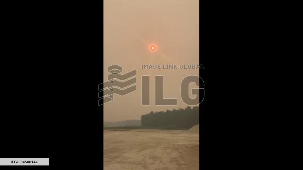 Canada: Wildfires Rage Across Manitoba, Blanketing Skies in Smoke