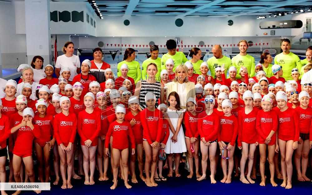 NO TABLOIDS - Brigitte Macron and Princess Charlene at the Water Safety Day Event