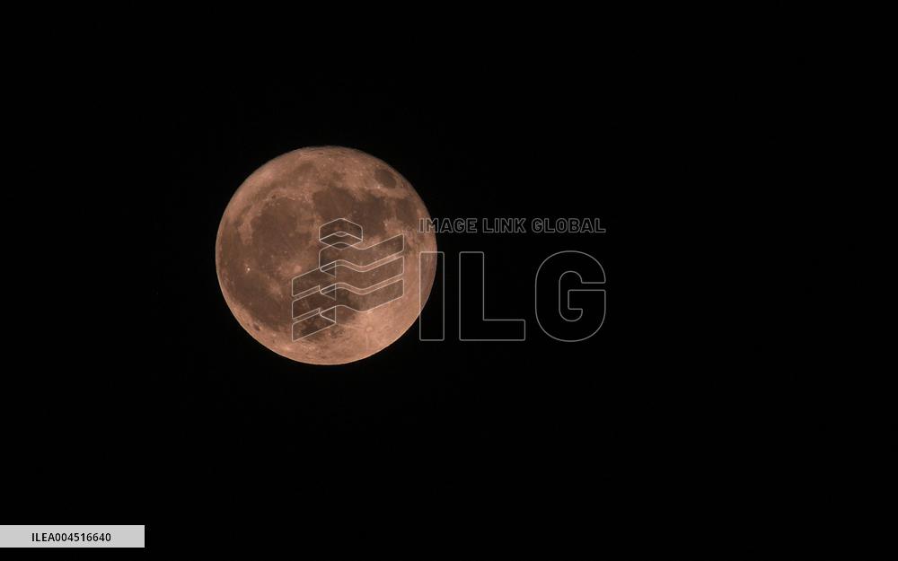 Strawberry Moon Over Iran