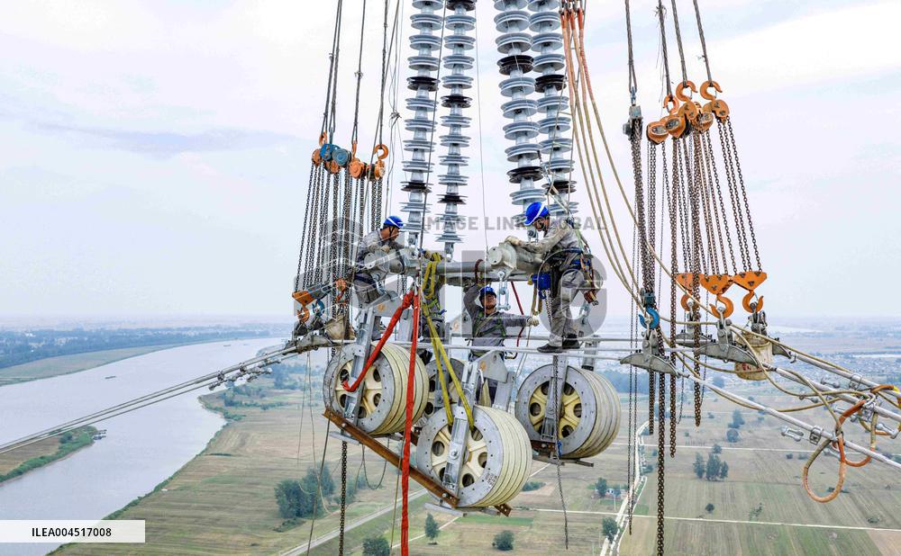 Workers on Power Transmission Line - China