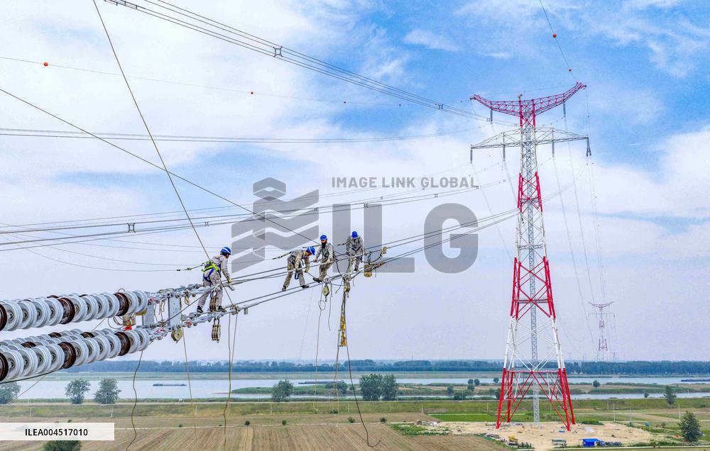Workers on Power Transmission Line - China