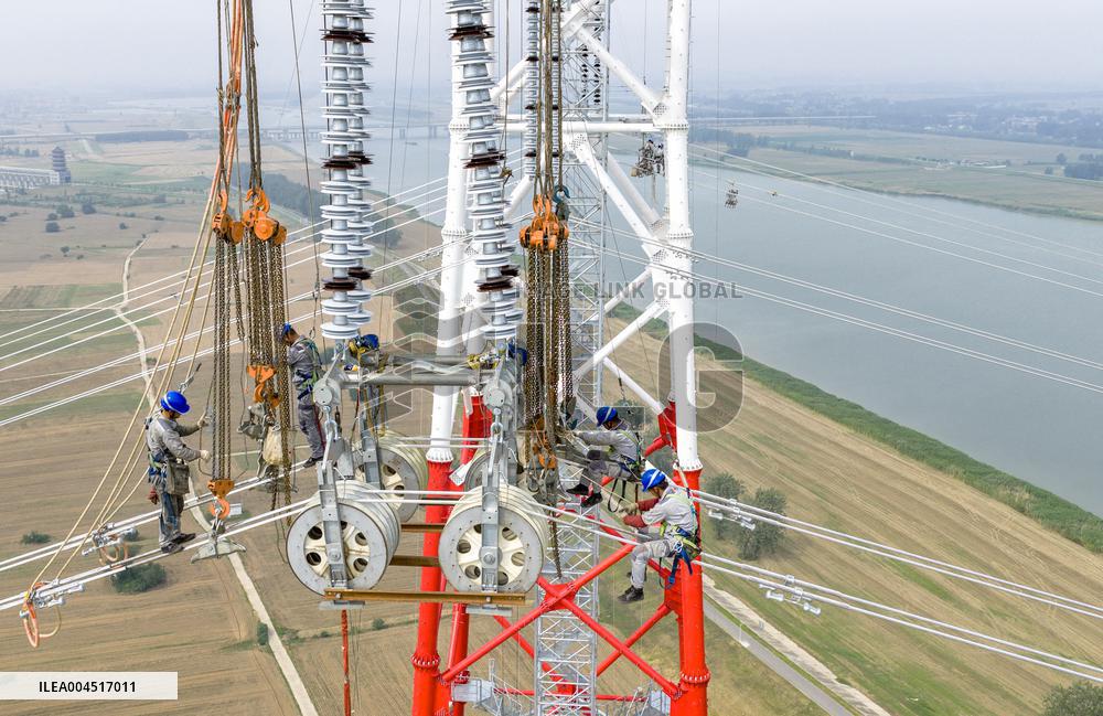 Workers on Power Transmission Line - China