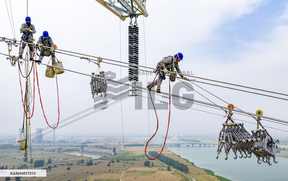 Workers on Power Transmission Line - China