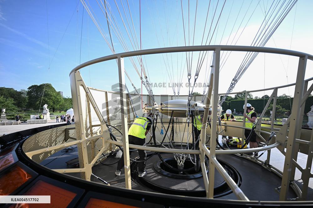 Macron Visits The Olympic Cauldron Reinstallation Site - Paris