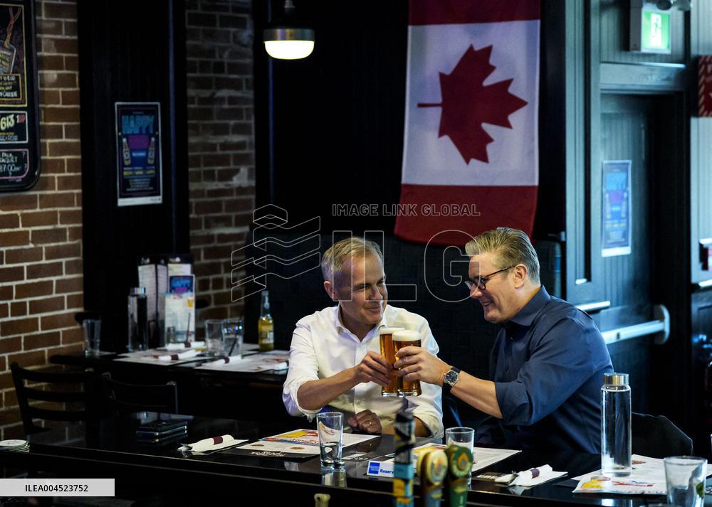 Carney And Starmer Watch Ice Hockey Match in Pub - Ottawa