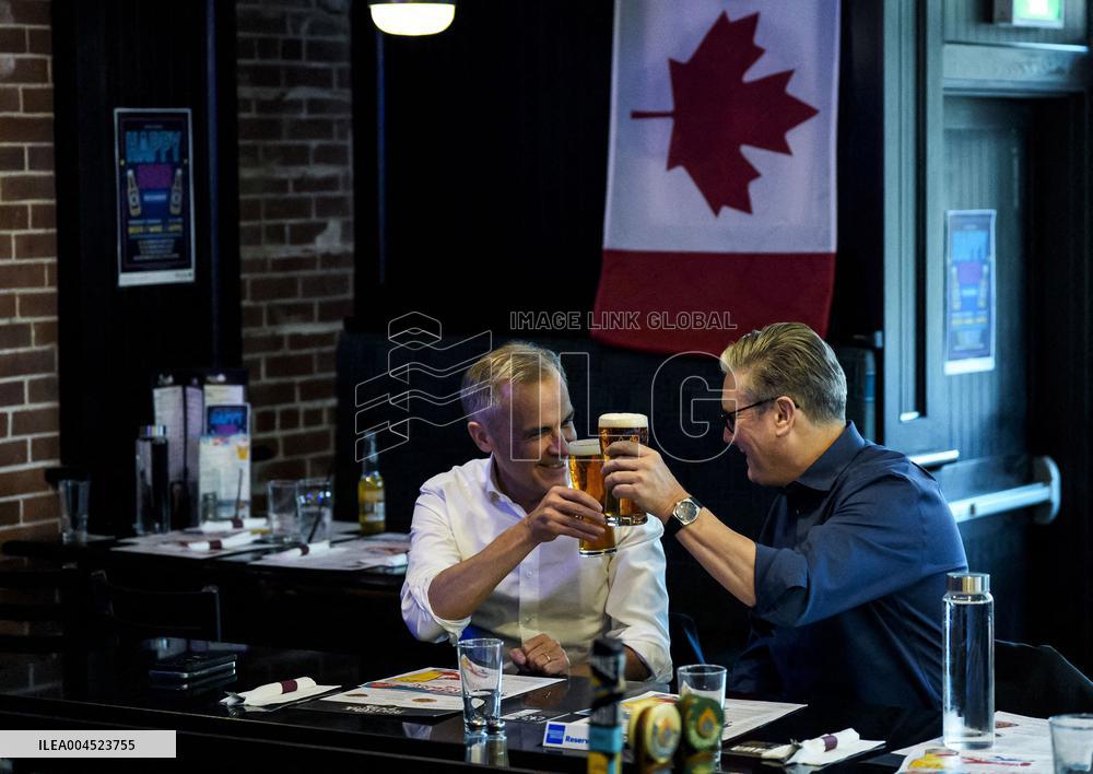 Carney And Starmer Watch Ice Hockey Match in Pub - Ottawa