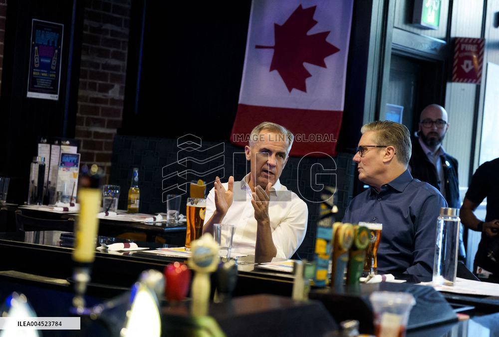 Carney And Starmer Watch Ice Hockey Match in Pub - Ottawa