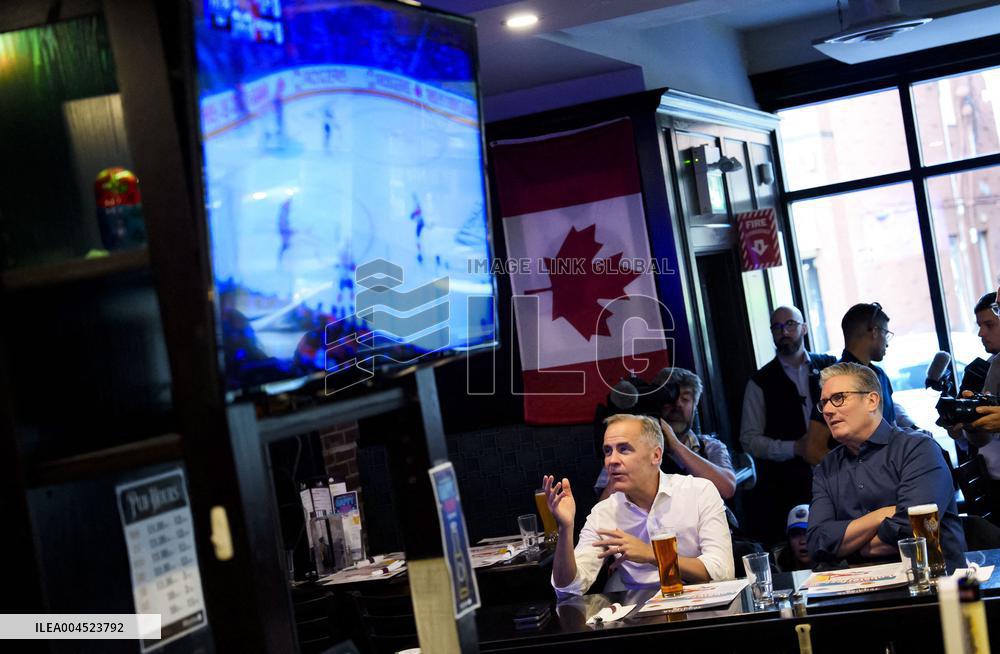 Carney And Starmer Watch Ice Hockey Match in Pub - Ottawa
