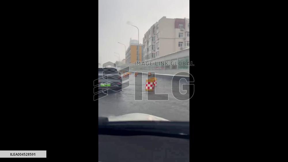China: Floating Traffic Barriers Turn Flooded Street Into Surreal Parade in Qingdao