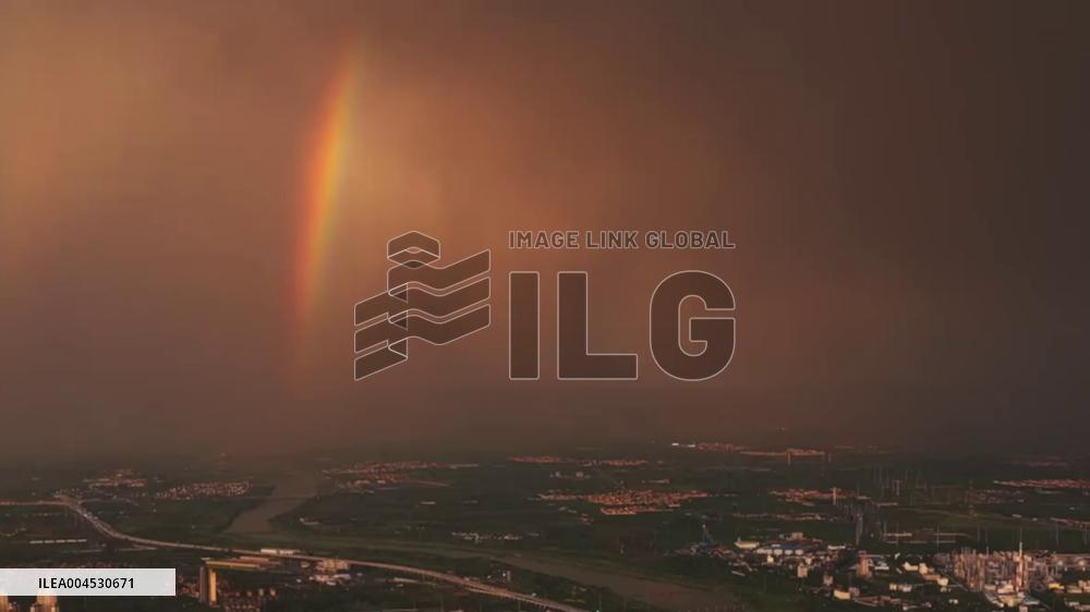 China: Lightning Strikes Through Rainbow as Sunset Paints Sky in Inner Mongolia