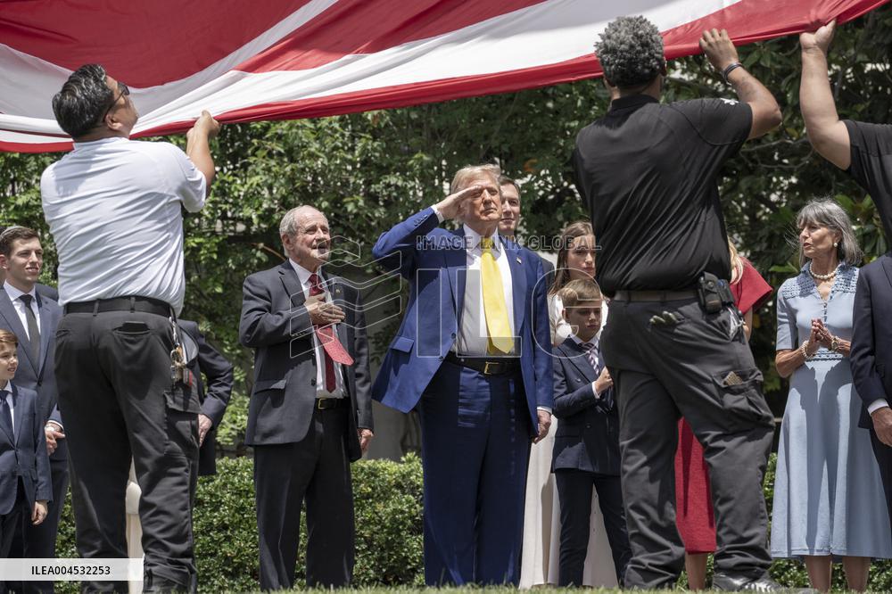U.S. President Donald Trump Watches as the American Flag is Raised ont he South Lawn
