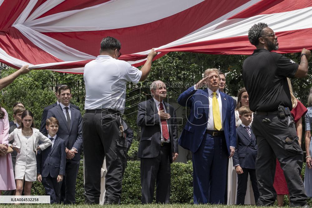 U.S. President Donald Trump Watches as the American Flag is Raised ont he South Lawn