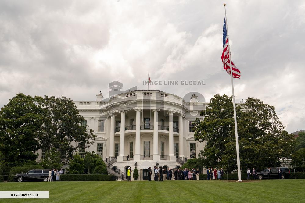 U.S. President Donald Trump Watches as the American Flag is Raised ont he South Lawn