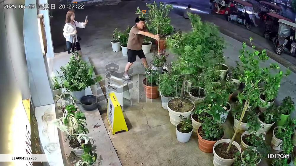 China: Man Escapes Seconds Before Wind Blows Shed Onto Sidewalk