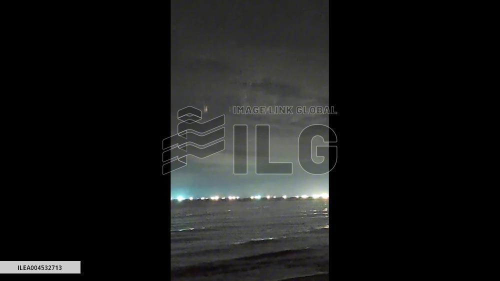 China: Mysterious Vertical Lights Appear Over Hainan Night Sky
