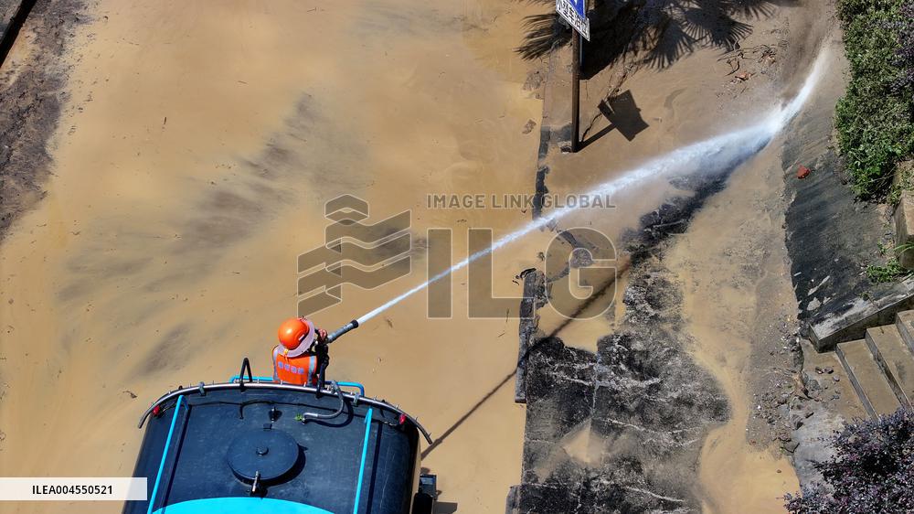 Clearing Silt After Flood in Rong'an