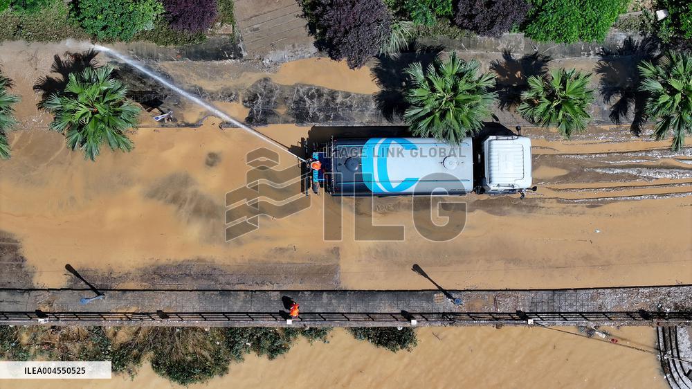 Clearing Silt After Flood in Rong'an