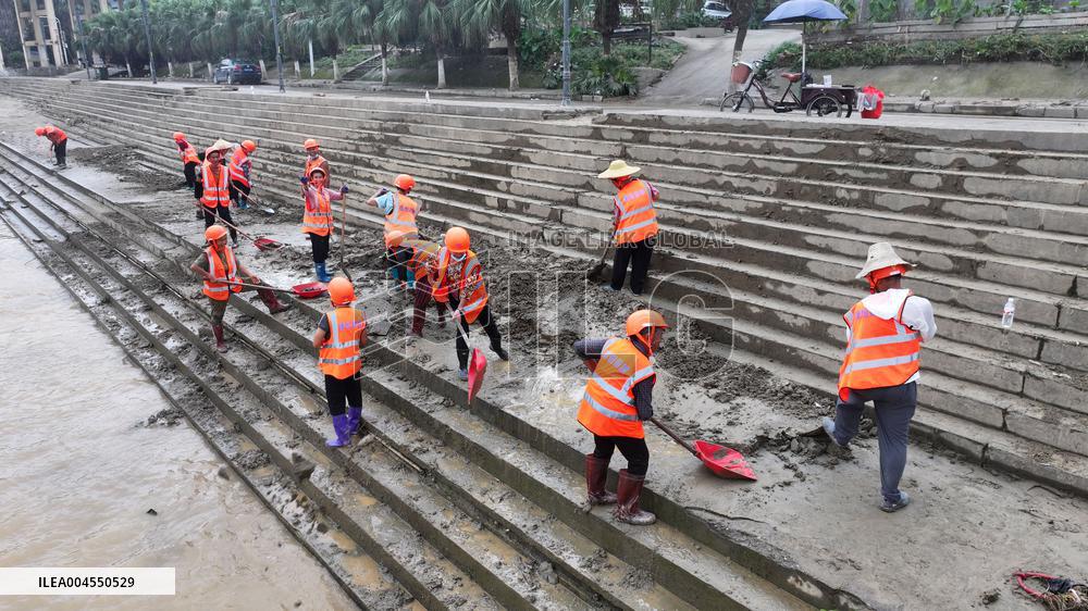 Clearing Silt After Flood in Rong'an