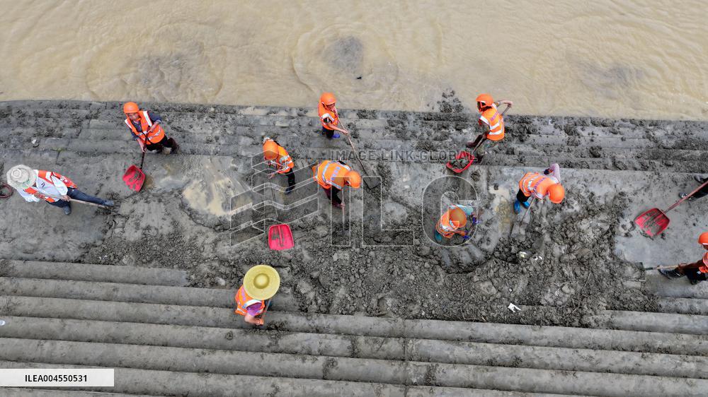 Clearing Silt After Flood in Rong'an