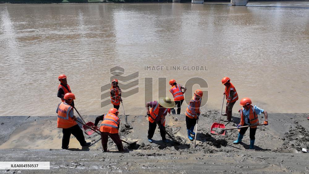 Clearing Silt After Flood in Rong'an
