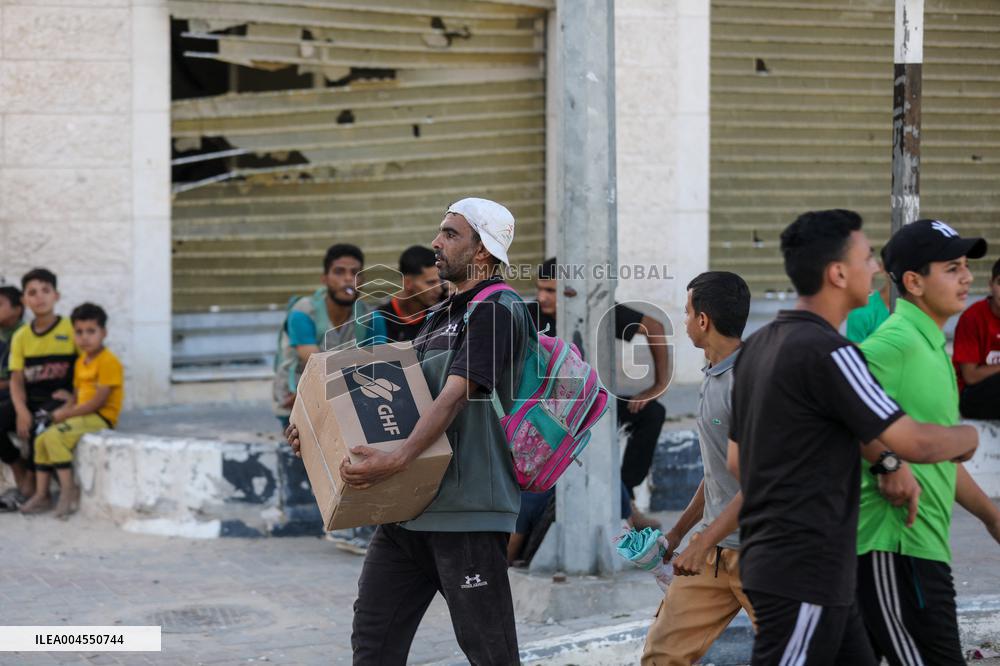 Palestinians Carry Collected Tree Branches and Scrap Wood - Gaza
