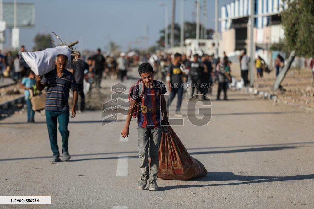 Palestinians Carry Collected Tree Branches and Scrap Wood - Gaza