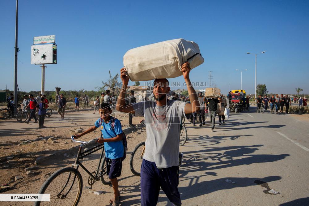 Palestinians Carry Collected Tree Branches and Scrap Wood - Gaza