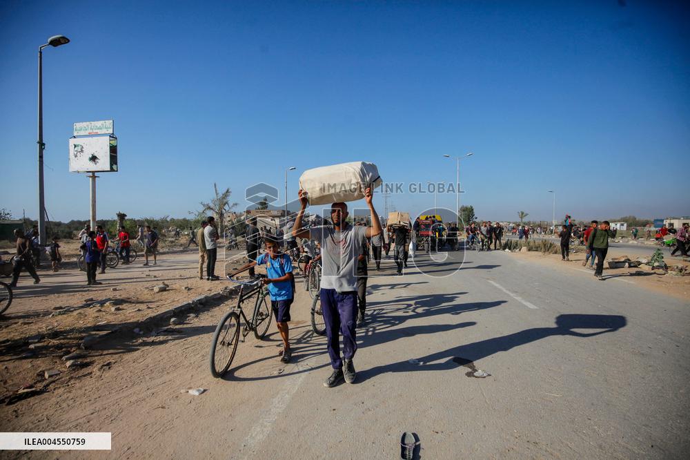 Palestinians Carry Collected Tree Branches and Scrap Wood - Gaza