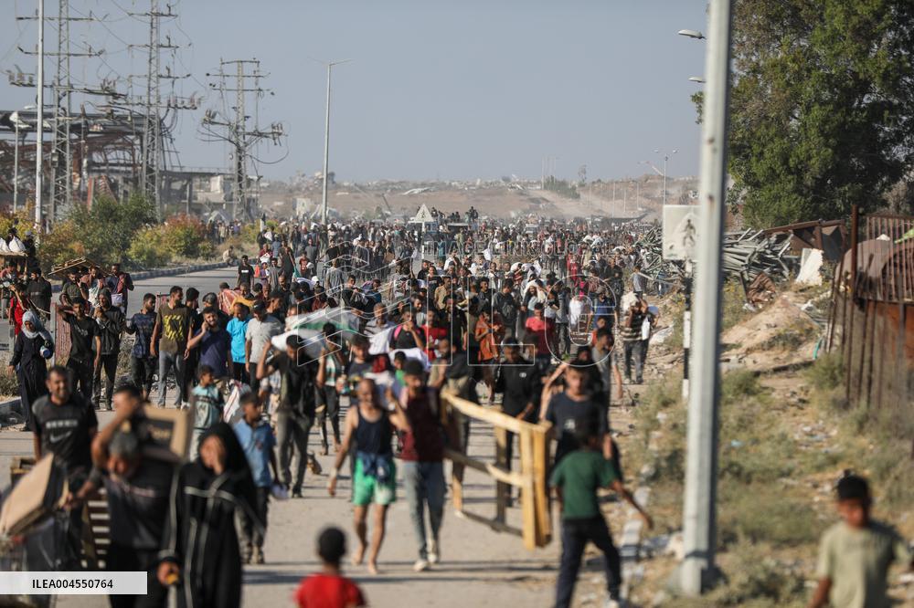 Palestinians Carry Collected Tree Branches and Scrap Wood - Gaza