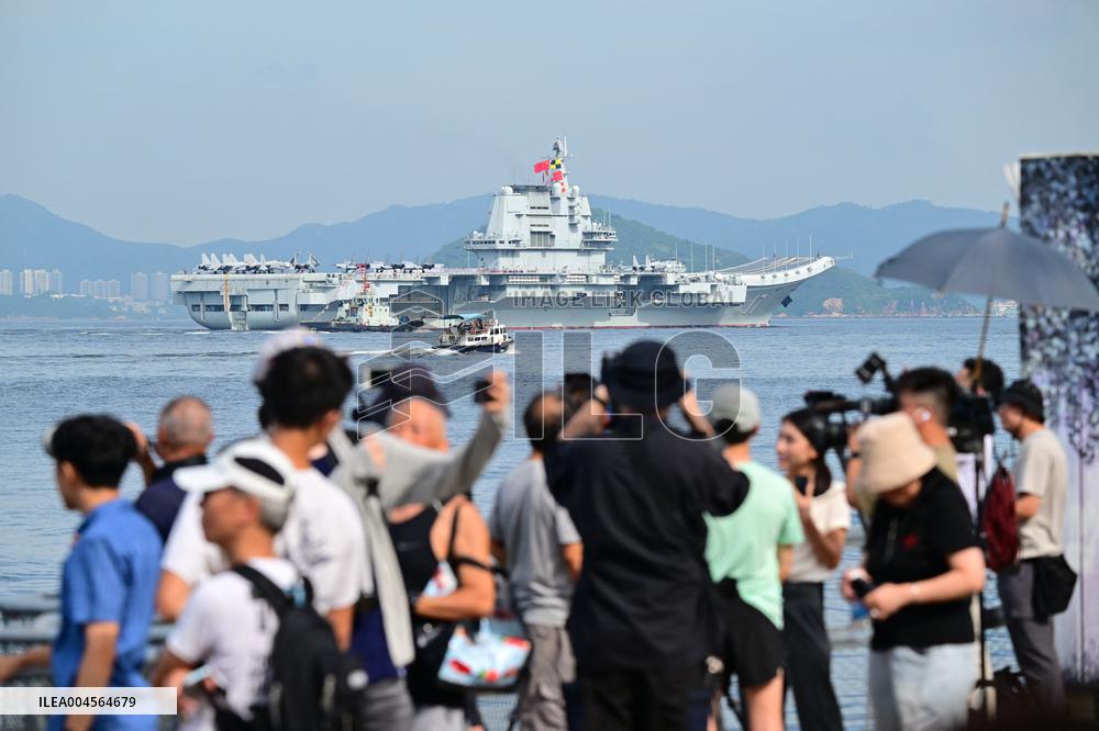 Aircraft Carrier Shandong Sailing In Hong Kong Waters